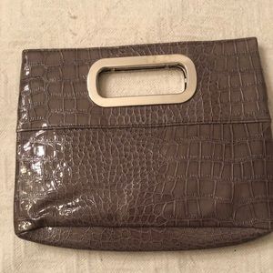 Sexy clutch purse with silver handles. New / never used!